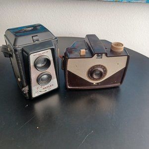 Two Vintage Cameras Sawyer Nomad 620 And USCC Color ReflexWith Staps